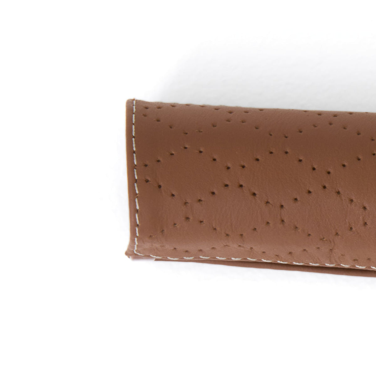 Leather Grips for Switchback – close-up of perforated brown grip and stitched edge