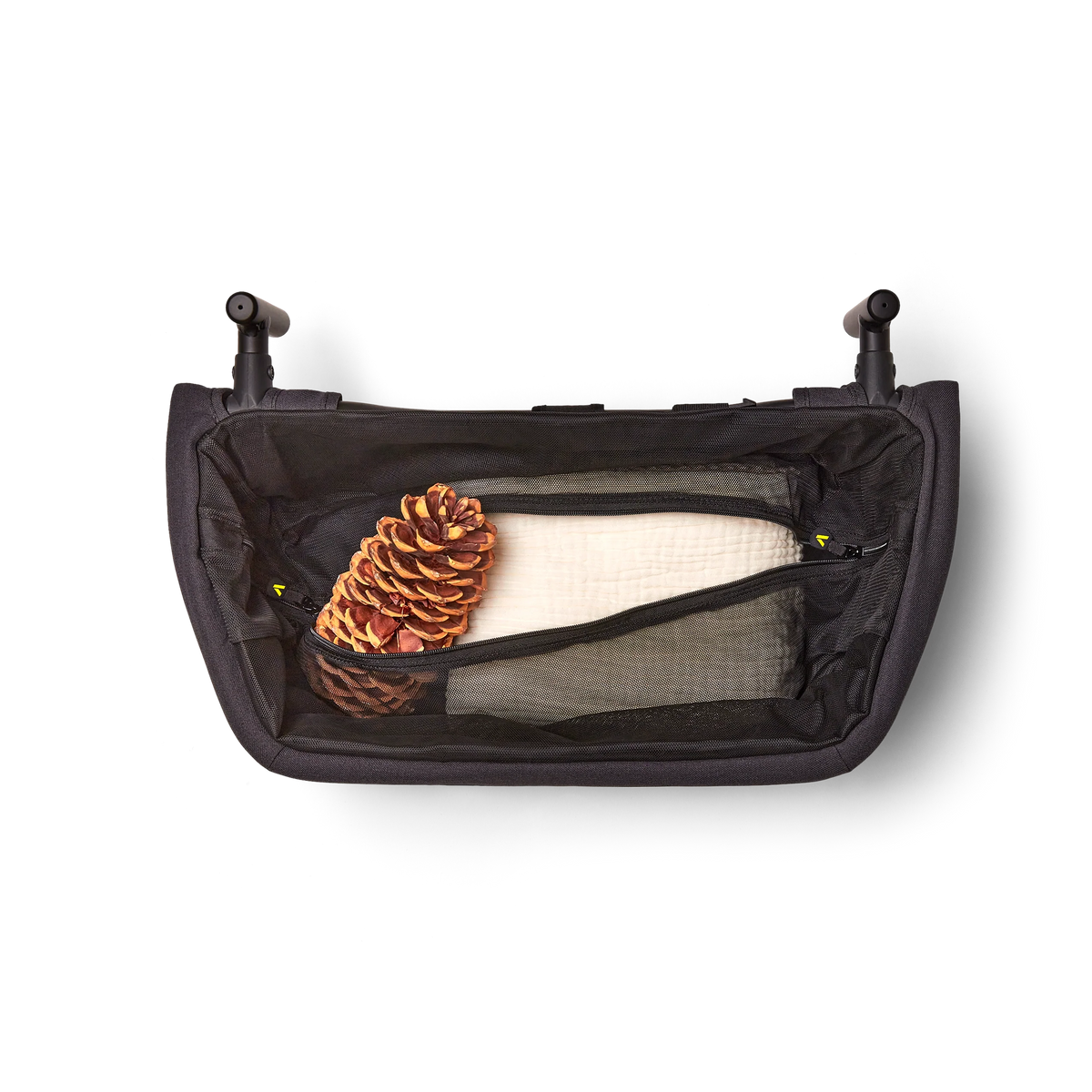 Foldable Storage Basket – front pocket holding cushion and pine cone